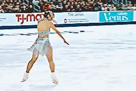 alysa liu doing a bit of choreography where she bends forward dramatically