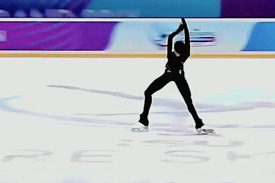 sofia dzepka doing a cool choreographic move on the ice where she bends backward with her form arched and folds her arms over her chest