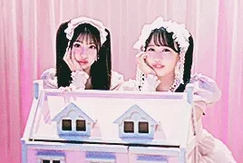 idol group piki posing behind a doll house in their music video for 'kawaii kaiwai'