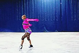 starr andrews doing a spin and dramatically flicking her head